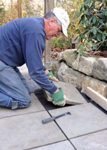 Putting down paving stones