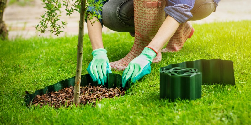 gardener maintaining mulch